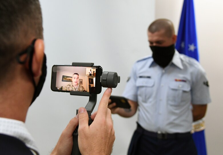 U.S. Air Force retired Maj. Hunter Jones delivers remarks via zoom during a presentation ceremony inside the Levitow Training Support Facility at Keesler Air Force Base, Mississippi, Sept. 11, 2020. Airman Joshua Balmer, 737th Training Group basic military training graduate and son of fallen OSI Special Agent Ryan Balmer, was presented mementos by the detachment following his graduation from BMT. (U.S. Air Force photo by Kemberly Groue)