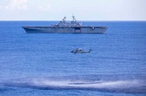 An MH-60R Sea Hawk helicopter attached to Helicopter Marine Strike Squadron (HSM) 46 prepares to lower a dipping sonar transducer during anti-submarine warfare (ASW) training with the amphibious assault ship USS Wasp (LHD 1).