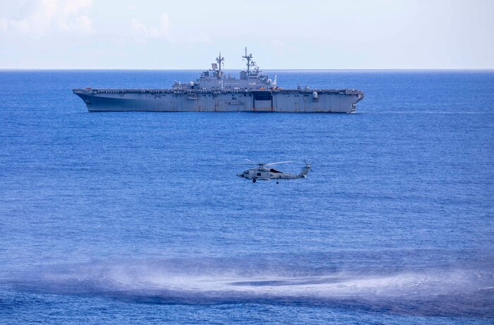 An MH-60R Sea Hawk helicopter attached to Helicopter Marine Strike Squadron (HSM) 46 prepares to lower a dipping sonar transducer during anti-submarine warfare (ASW) training with the amphibious assault ship USS Wasp (LHD 1).