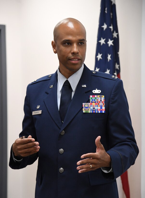 U.S. Air Force Special Agent Shannon Robinson, Air Force Office of Special Investigations Detachment 407 commander, delivers remarks during a presentation ceremony inside the Levitow Training Support Facility at Keesler Air Force Base, Mississippi, Sept. 11, 2020. Airman Joshua Balmer, 737th Training Group basic military training graduate and son of fallen OSI agent Ryan Balmer, was presented mementos by the detachment following his graduation from BMT. (U.S. Air Force photo by Kemberly Groue)