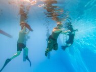 U.S. Coast Guardsmen conduct water survival training at Naval Support Activity Bahrain.