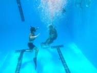 U.S. Coast Guardsmen conduct water survival training at Naval Support Activity Bahrain.