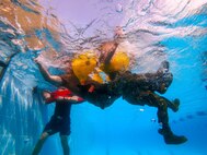 U.S. Coast Guardsmen conduct water survival training at Naval Support Activity Bahrain.