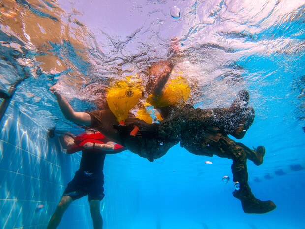 U.S. Coast Guardsmen conduct water survival training at Naval Support Activity Bahrain.