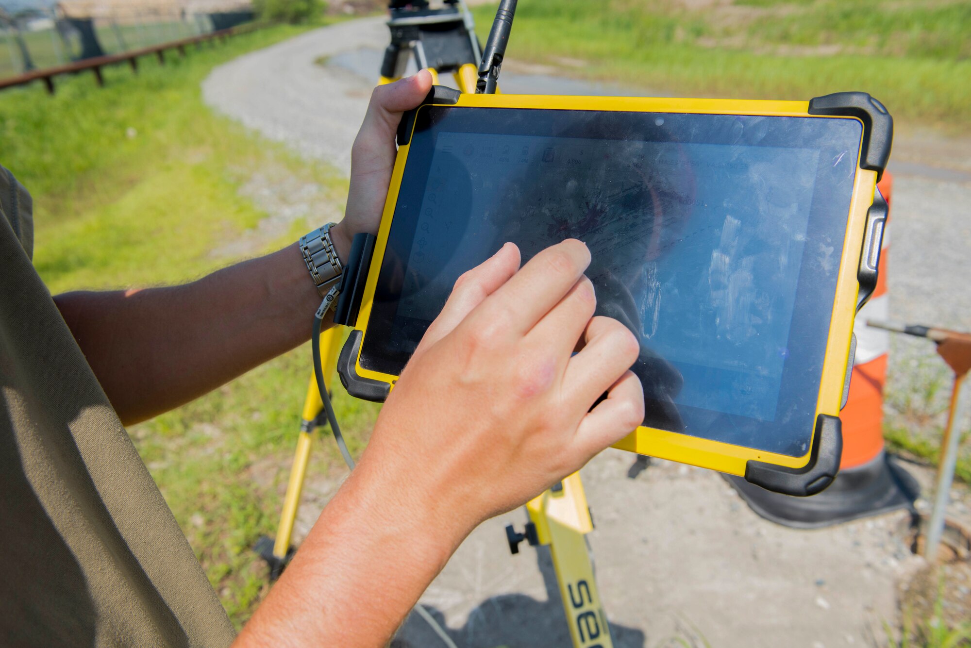 a photo of using a handheld computer