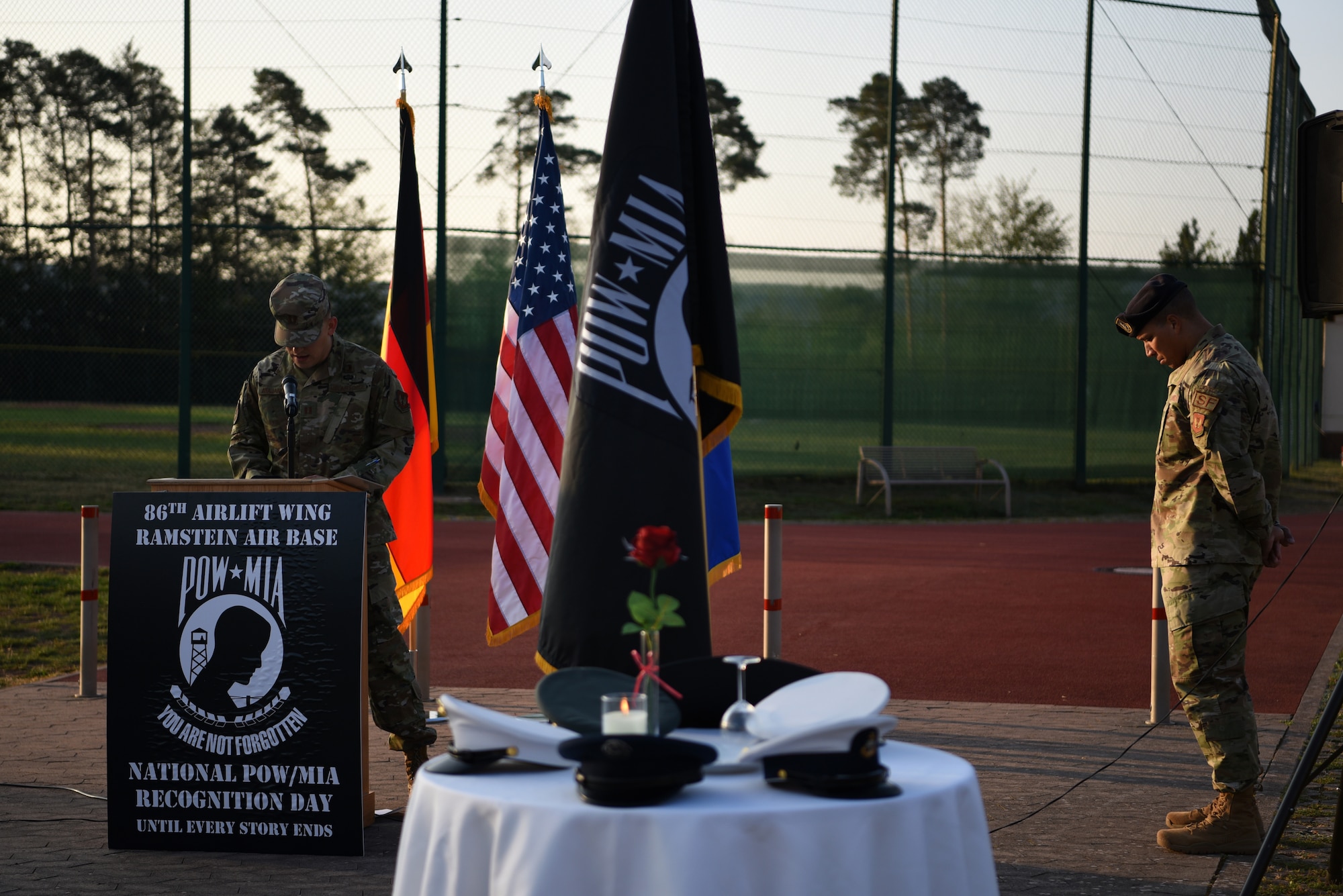 U.S. Air Force Capt. Isandar Atajanow, 86th Airlift Wing chaplain, left, leads the prayer during the National POW/MIA Recognition Day ceremony at Ramstein Air Base, Germany, Sept. 18, 2020.