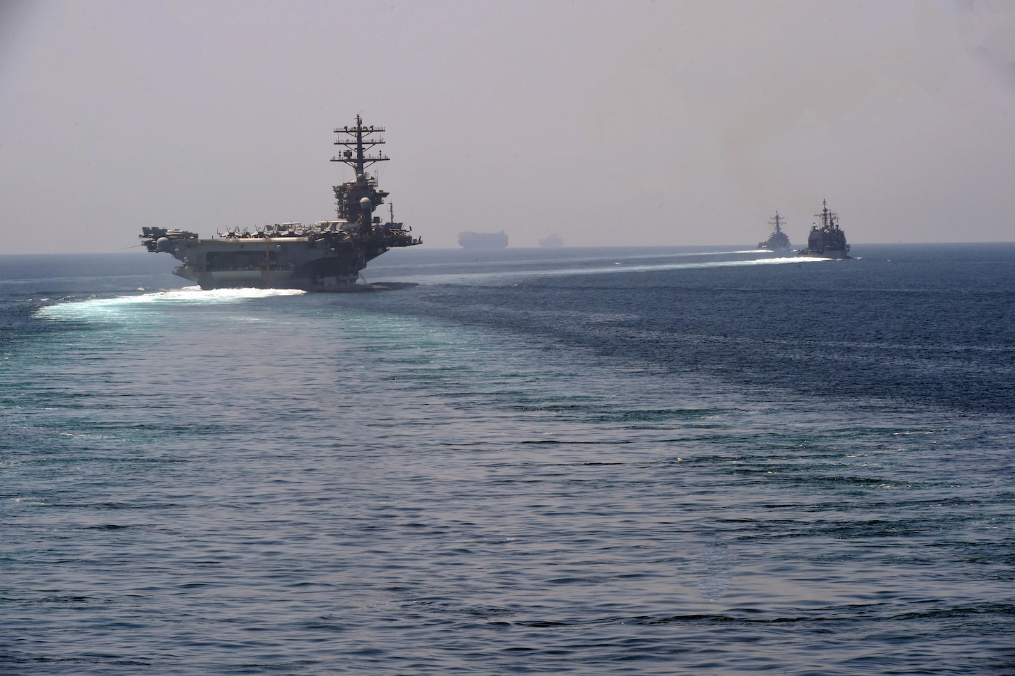 USS Nimitz with Accompanying Carrier Strike Group Ships Enter Arabian ...