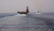 200918-N-IE405-1060 STRAIT OF HORMUZ (Sep. 18, 2020) The aircraft carrier USS Nimitz (CVN 68), guided-missile cruiser USS Princeton (CG 59) and guided-missile destroyer USS Sterett (DDG 104) steam in formation during a Strait of Hormuz transit, Sept. 18. The Nimitz Carrier Strike Group is deployed to the U.S. 5th Fleet area of operations in support of naval operations to ensure maritime stability and security in the Central Region, connecting the Mediterranean and the Pacific through the western Indian Ocean and three strategic chokepoints. (U.S. Navy photo by Mass Communication Specialist 2nd Class Indra Beaufort)