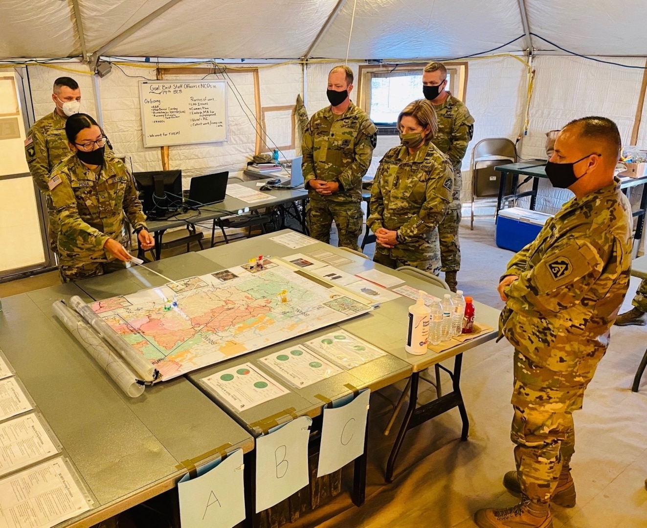 Lt. Gen. Laura J. Richardson, commanding general, United States Army North (Fifth Army) receives a brief from Pfc. Pena, detailing the progress that 14th Brigade Engineer Battalion and 2nd Battalion, 17th Field Artillery Regiment Soldiers have made thus far during her visit to the August Complex base camp in Stonyford, Calif., Monday, Sept. 14, 2020.