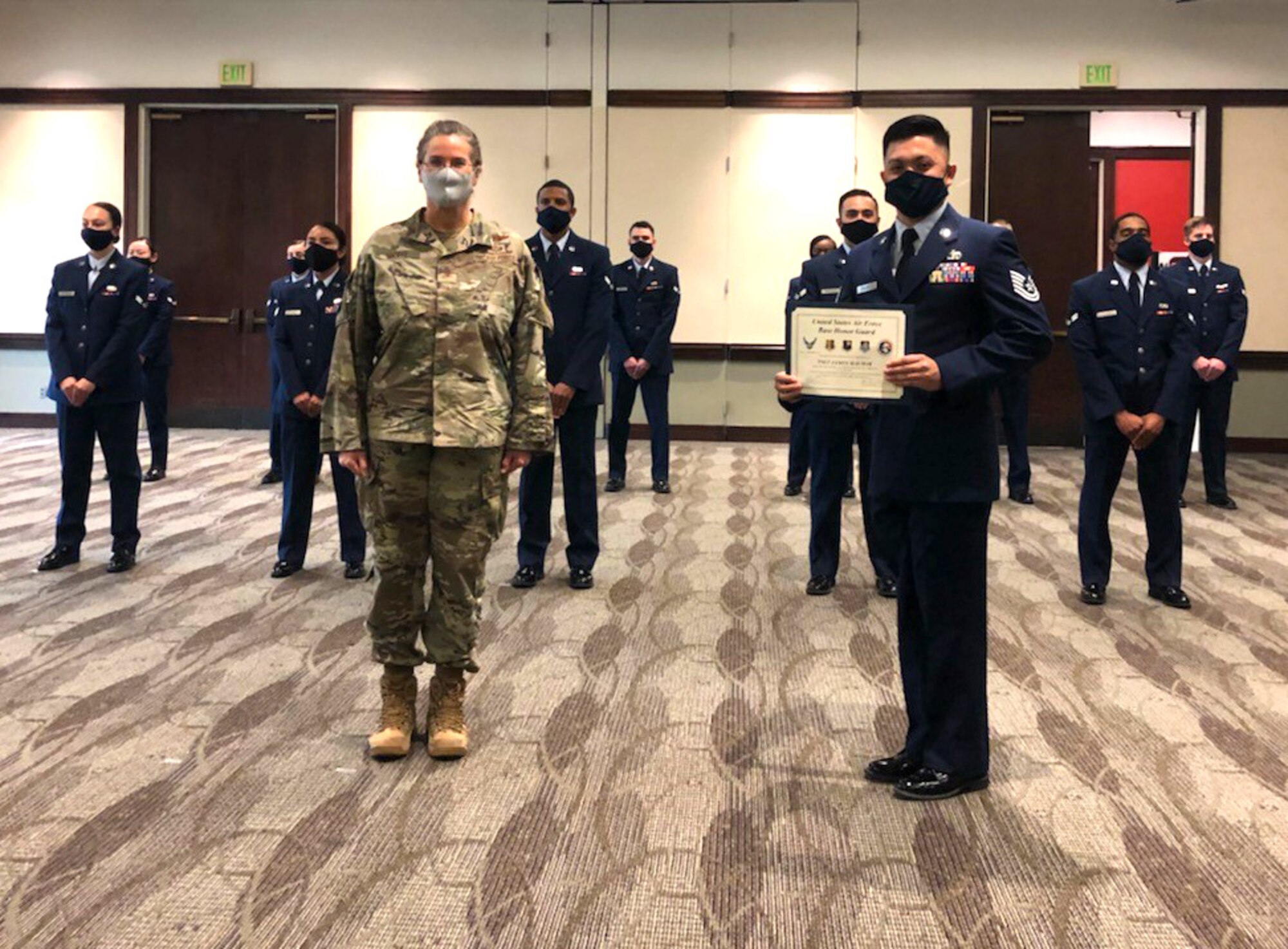 Col. Jacquelyn L. Marty, Vice Commander, 349th Air Mobility Wing, was on hand to congratulate Tech. Sgt. James Mauhay, 82nd Aerial Port Squadron, who is the newest member of the United States Air Force Base Honor Guard.
