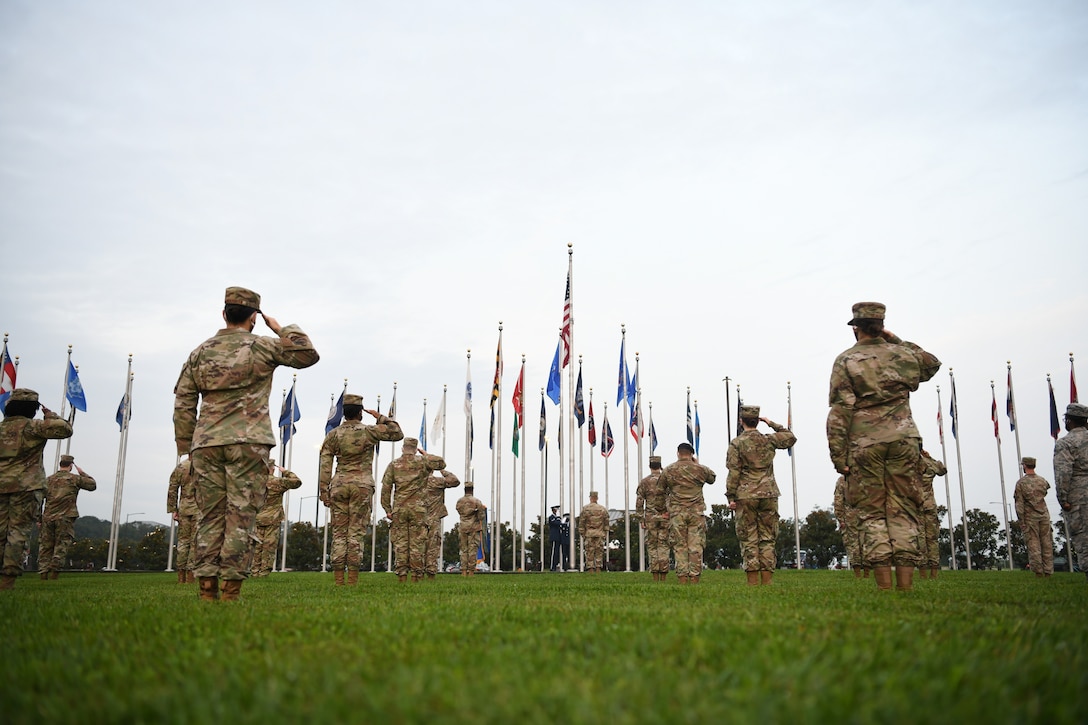 Joint Base Andrews Airmen salute the flag during a reveille ceremony in honor of the 73rd Air Force Birthday at JBA, Md., Sept. 18, 2020. Reveille signifies the start of the duty day and is initiated with a bugle call, which is followed by the playing of "To the Colors.” (U.S. Air Force photo by Airman 1st Class Spencer Slocum)