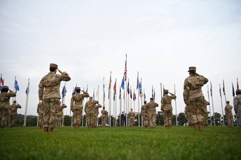 Joint Base Andrews Airmen salute the flag during a reveille ceremony in honor of the 73rd Air Force Birthday at JBA, Md., Sept. 18, 2020. Reveille signifies the start of the duty day and is initiated with a bugle call, which is followed by the playing of "To the Colors.” (U.S. Air Force photo by Airman 1st Class Spencer Slocum)