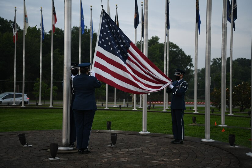 The Joint Base Andrews Honor Guard raises the flag during a reveille ceremony in honor of the 73rd Air Force Birthday at JBA, Md., Sept. 18, 2020. Reveille signifies the start of the duty day and is initiated with a bugle call, which is followed by the playing of "To the Colors.” (U.S. Air Force photo by Airman 1st Class Spencer Slocum)
