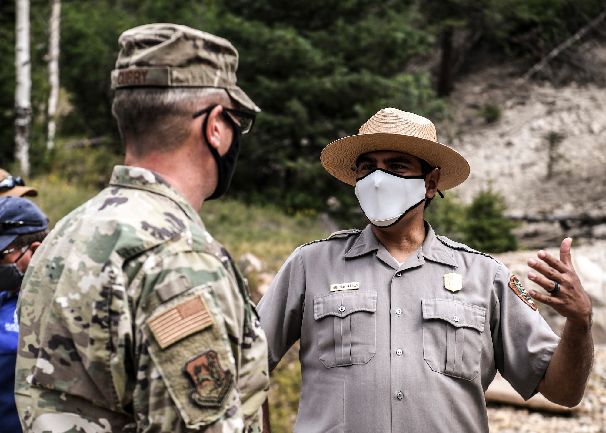 Two men talking outdoors