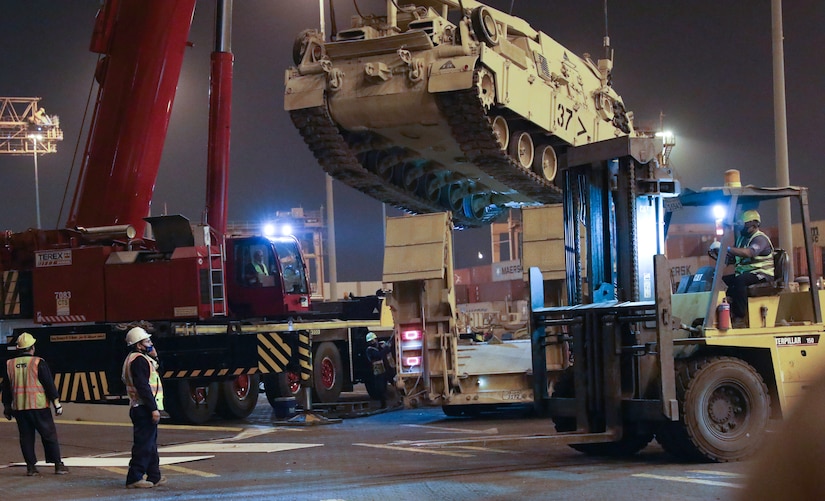 Contractors move a tank into position to be loaded at the Port of Shuiaba, Kuwait, September 11, 2020. The 1184th Deployment and Distribution Support Battalion, from Mobile, AL plays a vital role by relocating equipment because units rely on the equipment to carry out their missions. (U.S. Army Reserve Photo By Sgt. Vontrae Hampton)