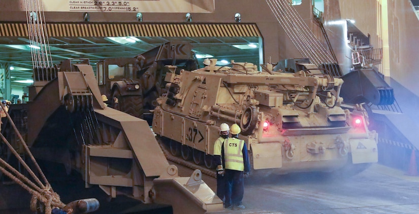 A Soldier from the 1184th Deployment and Distribution Support Battalion, from Mobile, AL drives a tank up the ramp and onto the ship at the Port of Shuiaba, Kuwait, September 11, 2020. The 1184th Deployment and Distribution Support Battalion, from Mobile, AL is responsible for the movement of nearly 400 pieces from several different units on this shipment. (U.S. Army Reserve Photo By Sgt. Vontrae Hampton)