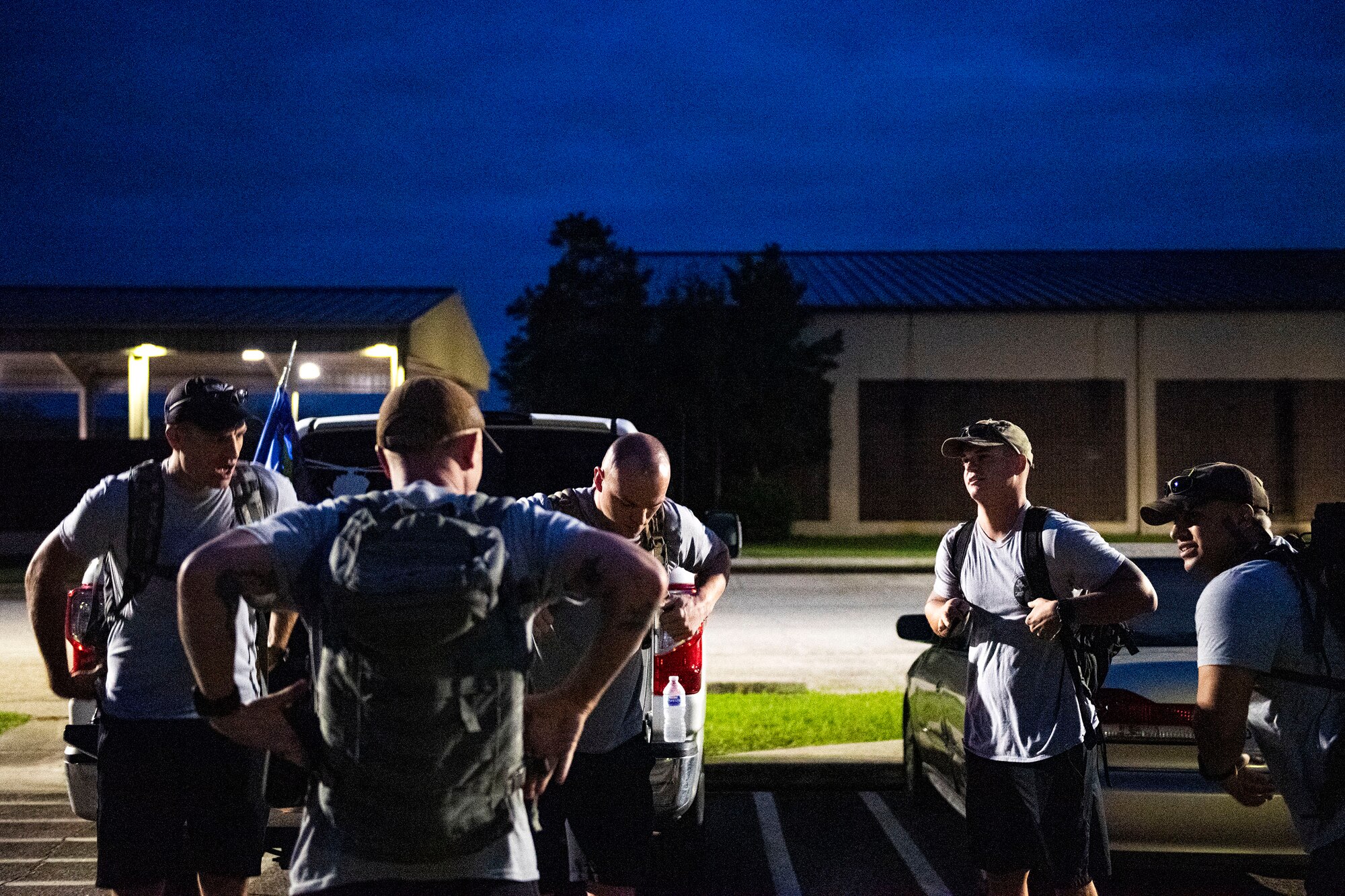 Photo of Airmen gearing up for a ruck march.