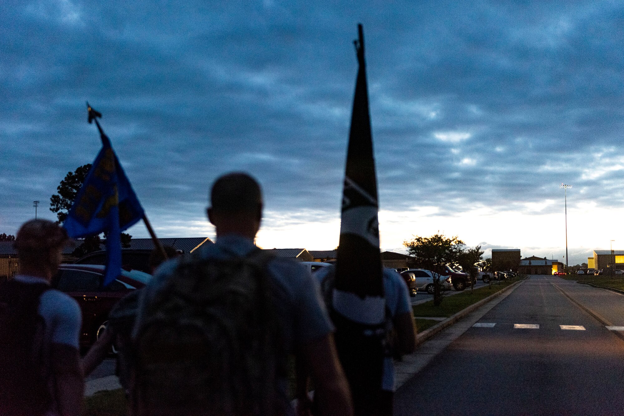 Photo of Airmen participating in a ruck march.