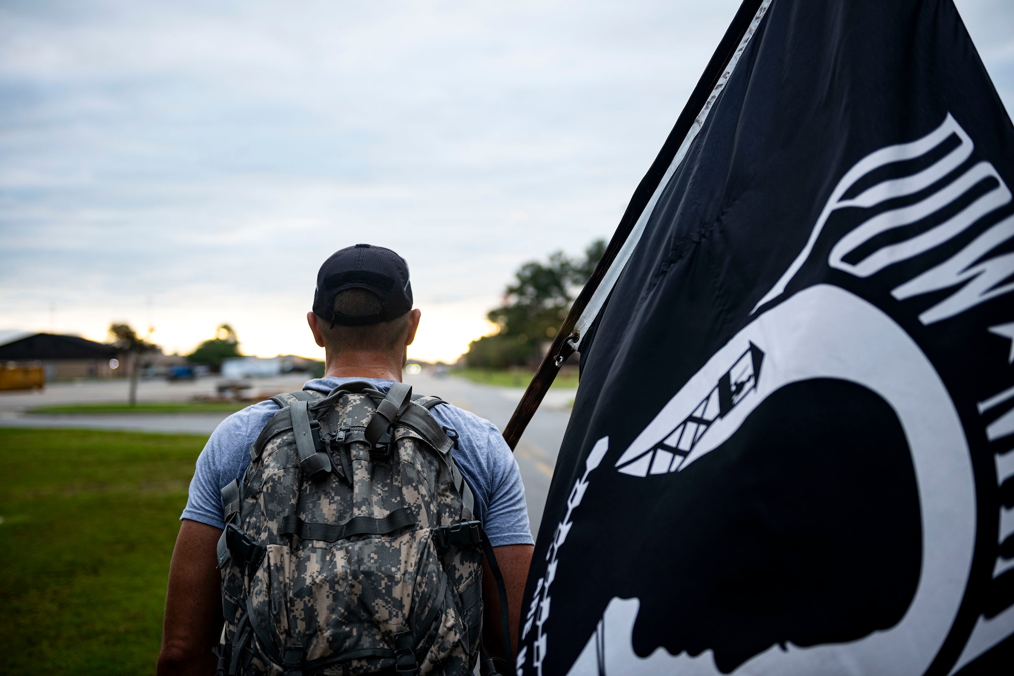 Photo of Airman participating in ruck march.
