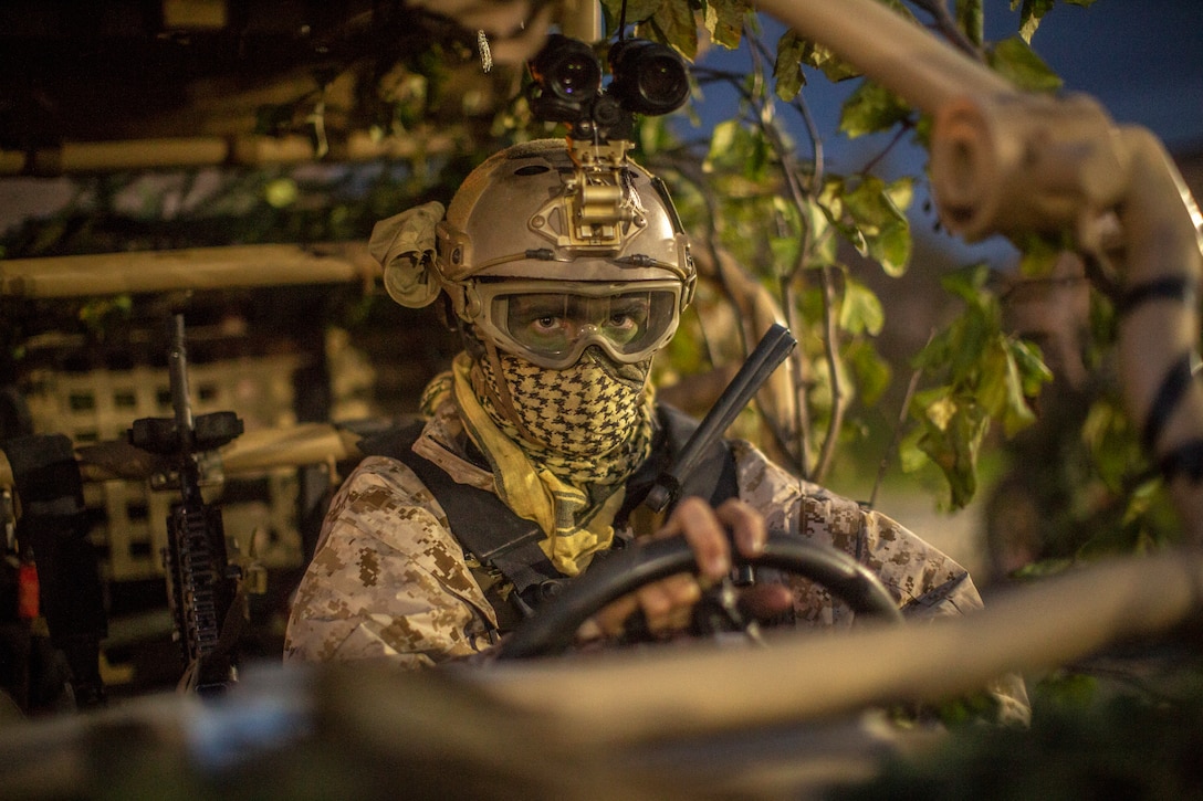 A U.S. Marine prepares to drive an MRZR during a tactical insert at Eielson Air Force Base, Alaska, Aug. 21.