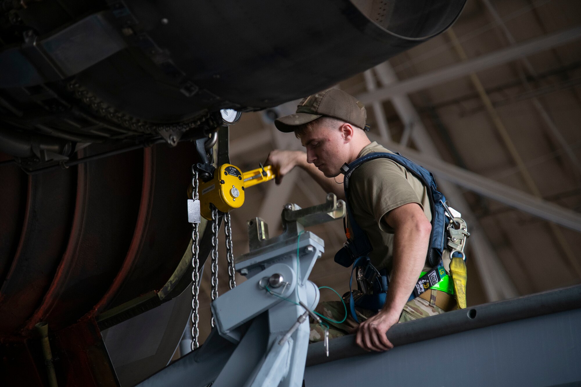Airman 1st Class Tyler Jackson, 436th Aircraft Maintenance Squadron aerospace propulsion journeyman, raises a pylon during a C-5M Super Galaxy engine change September 9, 2020, at Dover Air Force Base, Delaware. Weighing between five to six tons and costing 15.5 million dollars, C-5M engines are handled with precision and care. (U.S. Air Force photo by Airman 1st Class Jonathan Harding).