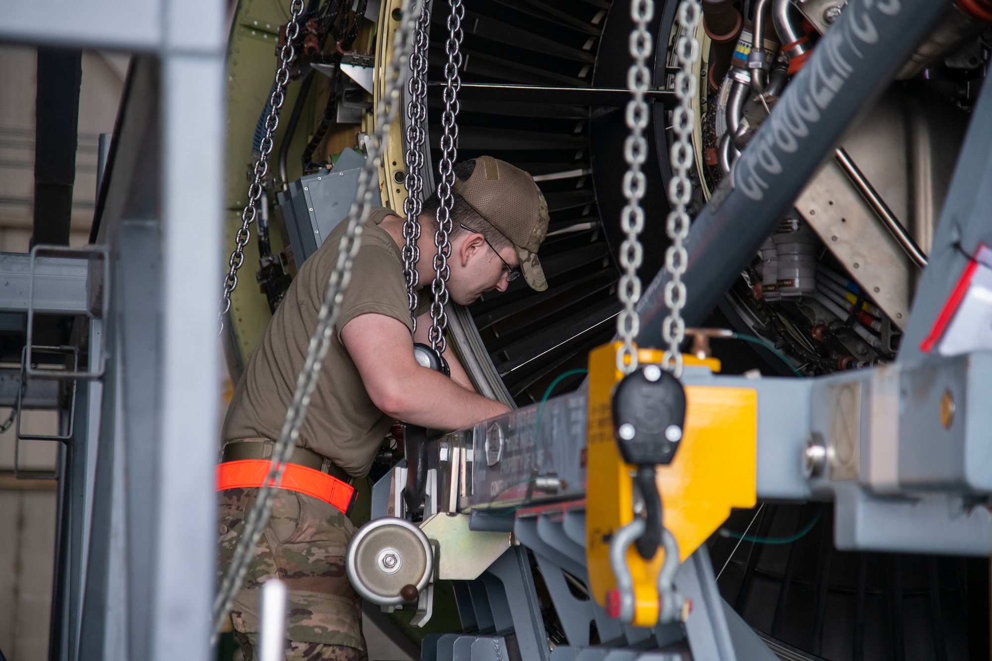 Senior Airman Kody Belt, 436th Aircraft Maintenance Squadron aerospace propulsion journeyman, secures the engine to a cradle C-5M Super Galaxy engine change September 9, 2020, at Dover Air Force Base, Delaware. This is the first C-5M engine change conducted by Airmen in six years. (U.S. Air Force photo by Airman 1st Class Jonathan Harding)