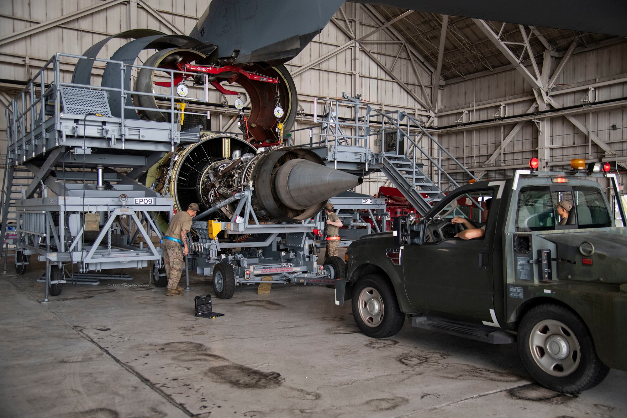 Maintainers prepare to move the recently lowered engine from under the C-5M Super Galaxy C-5M engine change September 9, 2020, at Dover Air Force Base, Delaware. This is the first C-5M engine change conducted by Airmen in six years. (U.S. Air Force photo by Airman 1st Class Jonathan Harding)