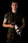 U.S. Marine Corps Cpl. Nathaniel Q. Hamilton, a native of Harve De Grace, Maryland, and a Combat Photographer with Headquarters Battalion, 2nd Marine Division, poses for a photo on Camp Lejeune, N.C., Sept. 17, 2020. Hamilton was chosen as the 2nd Marine Division motivator of the week for his outstanding leadership and unyielding motivation. (U.S. Marine Corps photo by Lance Cpl. Brian Bolin Jr.)