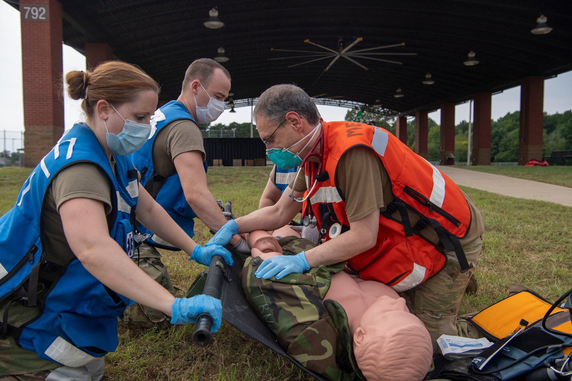 Medical Airmen simulate medical care during an exercise.