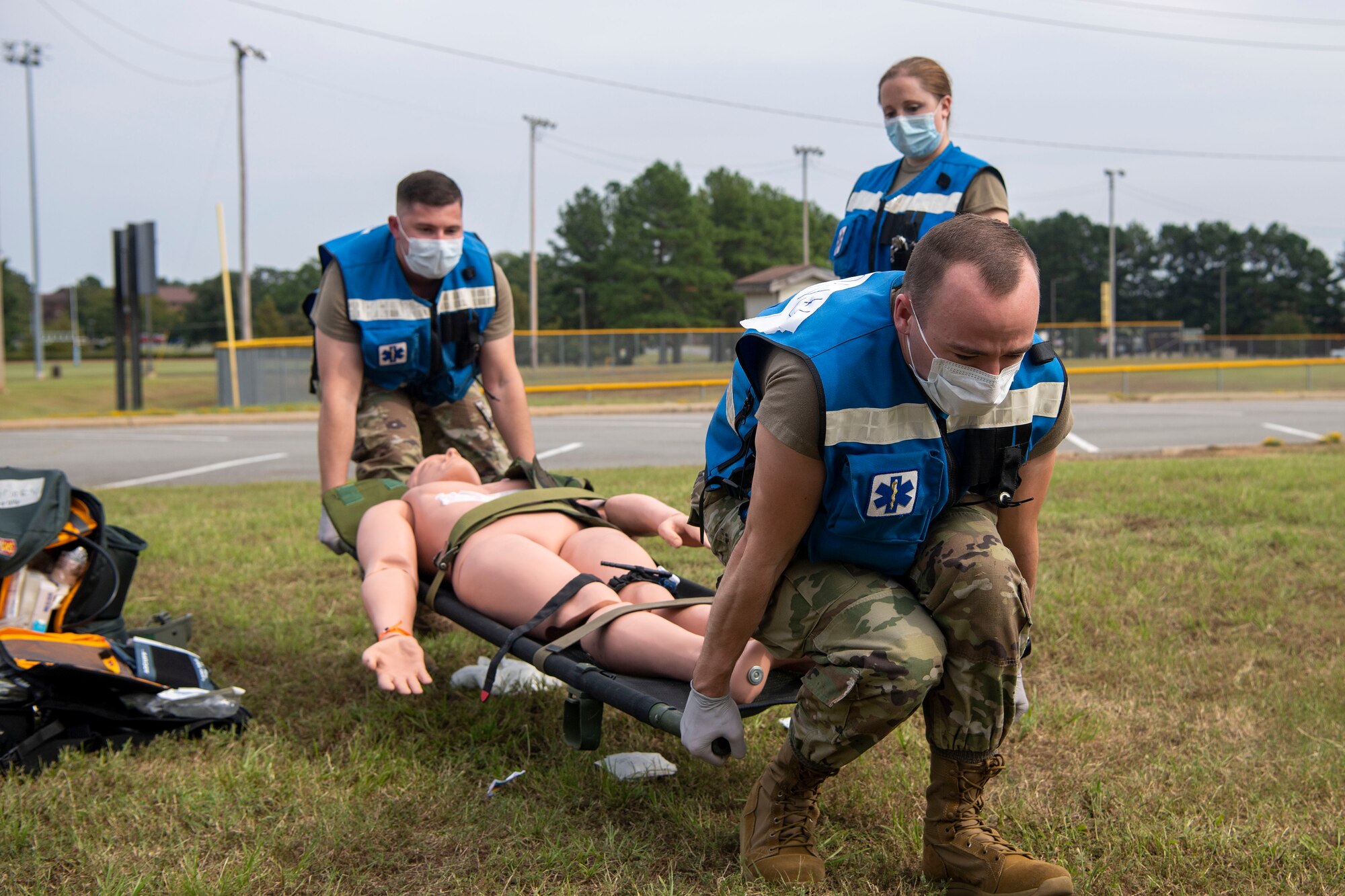Medical Airmen simulate medical care during an exercise.