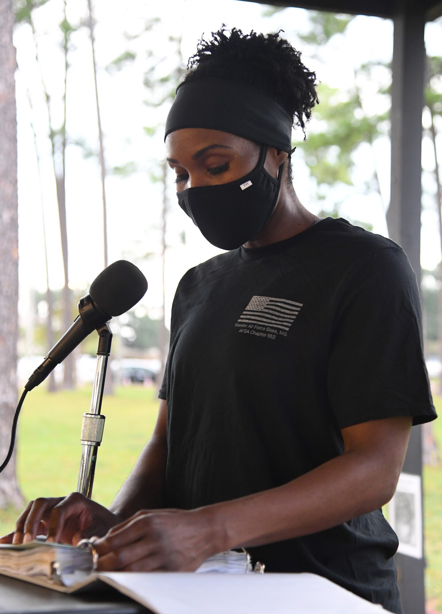 U.S. Air Force Tech. Sgt. Esi Jackson, 81st Dental Squadron oral surgery NCO in charge, reads the names of those who were prisoners of war or are missing in action during Keesler's POW/MIA 12-hour memorial run and vigil at the Crotwell Track at Keesler Air Force Base, Mississippi, Sept. 18, 2020. This event is held annually to raise awareness and pay tribute to all prisoners of war and the military members still missing in action. (U.S. Air Force photo by Kemberly Groue)