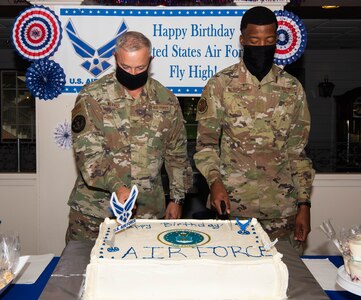 Airmen cut cake at Joint Base Langley-Eustis, Virginia.