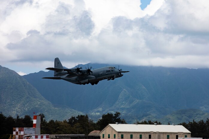 A KC-130J attached to Marine Aerial Refueler Transport Squadron 152 takes off during a Tilt Air to Air Refueling and Helicopter Air to Air Refueling exercise aboard Marine Corps Air Station Kaneohe Bay, Marine Corps Base Hawaii, July 23, 2020. MCAS, Marine Medium Tiltrotor Squadron 363, and Marine Heavy Helicopter Squadron 463 participated in the TAAR and HAAR training to increase readiness, proficiency, and unit cohesion with VMGR-152. (U.S. Marine Corps photo by Lance Cpl. Samantha Sanchez)