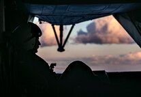 U.S. Marine Corps Cpl. Zachary Tucker, a crew chief with Heavy Helicopter Squadron 463, observes the perimeter during a convoy resupply aboard Marine Corps Training Area Bellows, July 29, 2020. HMH-463 and 1st Battalion, 12th Marine Regiment conducted convoy resupply training to support interoperability and demonstrate the capability of executing an expeditionary convoy resupply in austere environments. (U.S. Marine Corps photo by Lance Cpl. Jamie Shadwick)
