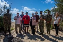 Marine Corps Base Hawaii personnel and Waimanalo Neighborhood Board representatives pose for a group photo during a visit to Marine Corps Training Area Bellows, Aug. 5, 2020. MCBH is committed to being good environmental stewards and has taken an active role in preserving the environment required for sea turtles in the region to flourish. While we must continue to train Marines to fight, protecting our natural resources plays an important role in MCBH's overall mission readiness. (U.S. Marine Corps photo by Cpl. Matthew Kirk)