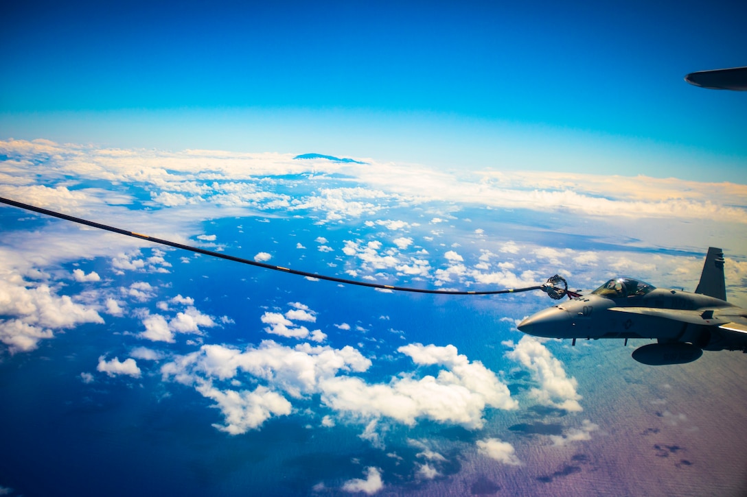 An F/A-18 Hornet with Marine Fighter Attack Squadron 115 receives fuel during an aerial refuel, Aug. 6, 2020. VMFA-115 and Marine Aerial Refueler Transport Squadron 152 conducted fixed wing aerial refueling in support of unit training, readiness, and proficiency. (U.S. Marine Corps photo by Cpl. Matthew Kirk)