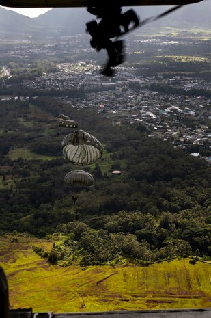 U.S. Marines with 4th Force Reconnaissance Company conduct a line jump during Airborne Operations at the Lightning Academy, East Range Training Complex, Hawaii, Aug. 11, 2020. The training was conducted as part of the unit’s annual training requirements with 3rd Radio Battalion, Marine Medium Tiltrotor Squadron 363, Naval Special Warfare, and 25th Infantry Division to build proficiency and maintain insert capabilities. (U.S. Marine Corps photo by Lance Cpl. Samantha Sanchez)