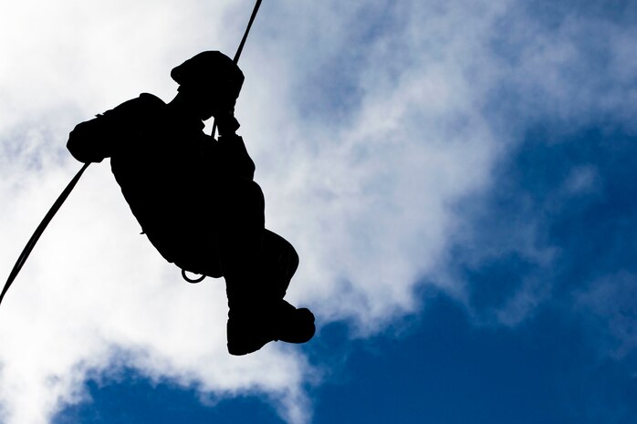 A U.S. Marine with Detachment 4th Force Reconnaissance Company, rappels from a skid at the Lightning Academy, East Range Training Complex, Hawaii, Aug. 11, 2020. The training was conducted as part of the reserve unit’s annual training requirements, and aimed to improve personnel’s expeditionary readiness. (U.S. Marine Corps photo by Sgt. Luke Kuennen)