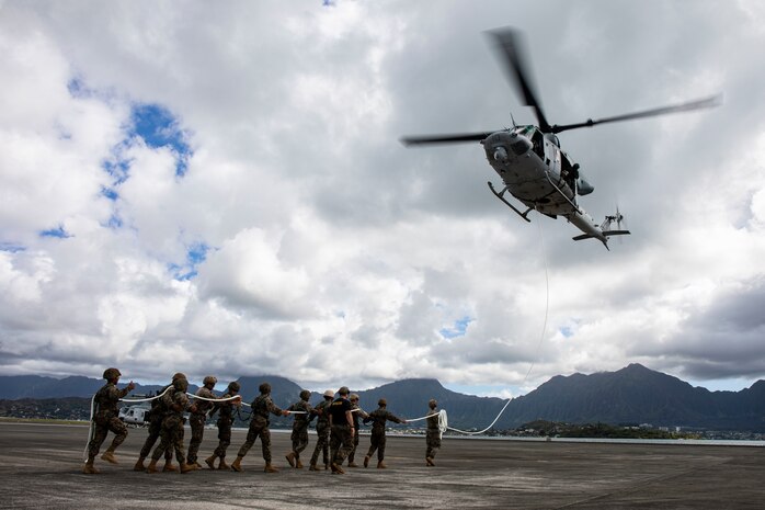 U.S. Marines with Detachment 4th Force Reconnaissance Company and 3rd Radio Battalion conduct Special Patrol Insertion/Extraction rigging operations aboard Marine Corps Base Hawaii, Aug. 14, 2020. The training was supplementary to 4th Force’s annual reserve training and aimed to increase the unit’s expeditionary readiness. (U.S. Marine Corps photo by Lance Cpl. Samantha Sanchez)