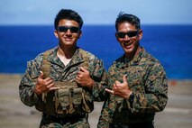 Lance Cpl. Aiden Wong, reconnaissance rover, 4th Force Reconnaissance Company, and Staff Sgt. Michael Wong, platoon sergeant, 4th Force Reconnaissance Company, pose for a photo at Kaneohe Bay Range, Marine Corps Base Hawaii, August 17, 2020. (U.S. Marine Corps photo by Sgt. Luke Kuennen)