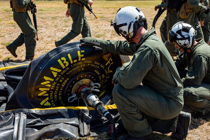 A U.S. Marine with Marine Heavy Helicopter Squadron 463 observes a fuel valve during a “Fly-Away” Forward Arming and Refueling Point exercise aboard Marine Corps Training Area Bellows, Aug. 25, 2020. HMH-463 and Marine Wing Support Detachment 24 Fuels Division conducted FARP and Air Delivered Ground Refueling training to produce expeditionary readiness and proficiency between the two units. (U.S. Marine Corps photo by Lance Cpl. Samantha Sanchez)