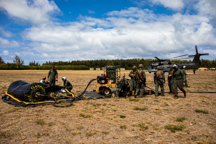 U.S. Marines with Marine Wing Support Detachment 24 Fuels Division and Marine Heavy Helicopter Squadron 463 offload gear during a “Fly-Away” Forward Arming and Refueling Point exercise aboard Marine Corps Training Area Bellows, Aug. 25, 2020. HMH-463 and MWSD-24 conducted FARP and Air Delivered Ground Refueling training to produce expeditionary readiness and proficiency between the two units. (U.S. Marine Corps photo by Lance Cpl. Samantha Sanchez)