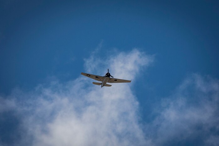A World War II Era Warbird flys over Marine Corps Base Hawaii during an aerial parade for the 75th Anniversary of the End of WW II Commemoration at Marine Corps Base Hawaii, Kaneohe Bay, August 29, 2020. World War II remains a historic reminder of how the dedicated resolve of allies with a common purpose and shared vision built proven partnerships that endure. The U.S. Military continues to stand together with allies and partners in maintaining a Free and Open Indo-Pacific. (U.S. Marine Corps photo by Lance Cpl. Shane Linder)