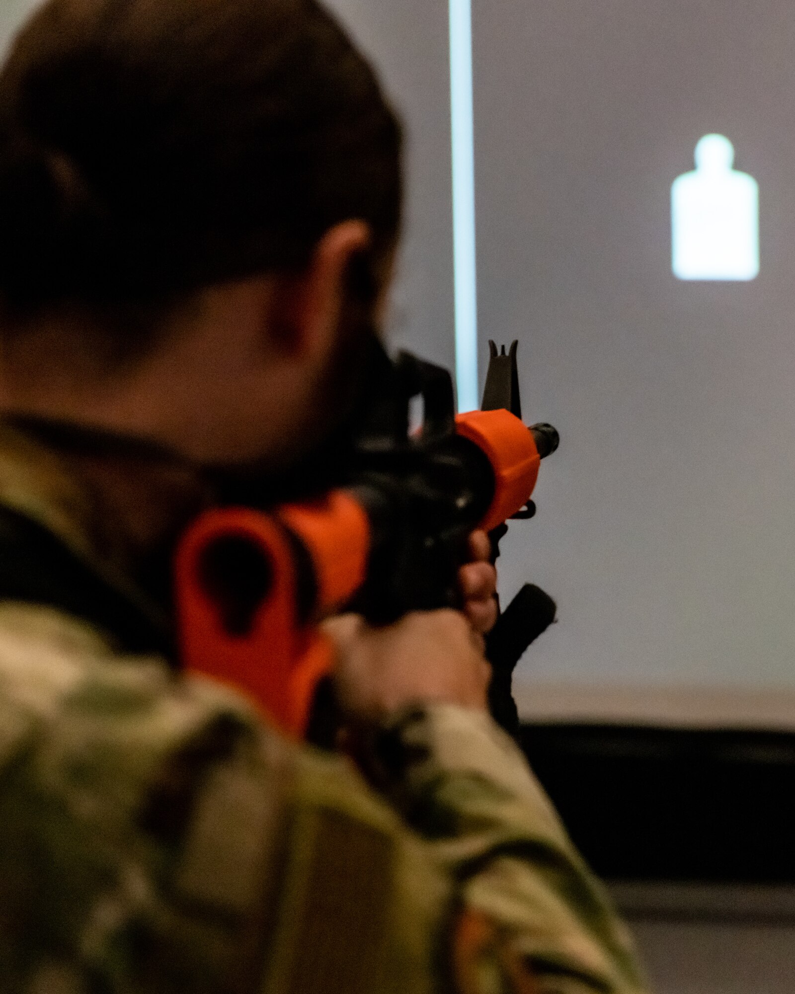 Staff Sgt. Erica Phillips, a fireteam member assigned to the 910th Security Forces Squadron, practices her quick response accuracy on the squadron’s state-of-the-art laser shot simulator, Sept. 12, 2020, Youngstown Air Reserve Station. The laser shot can simulate a wide variety of situations from simple target practice to time-critical situations.