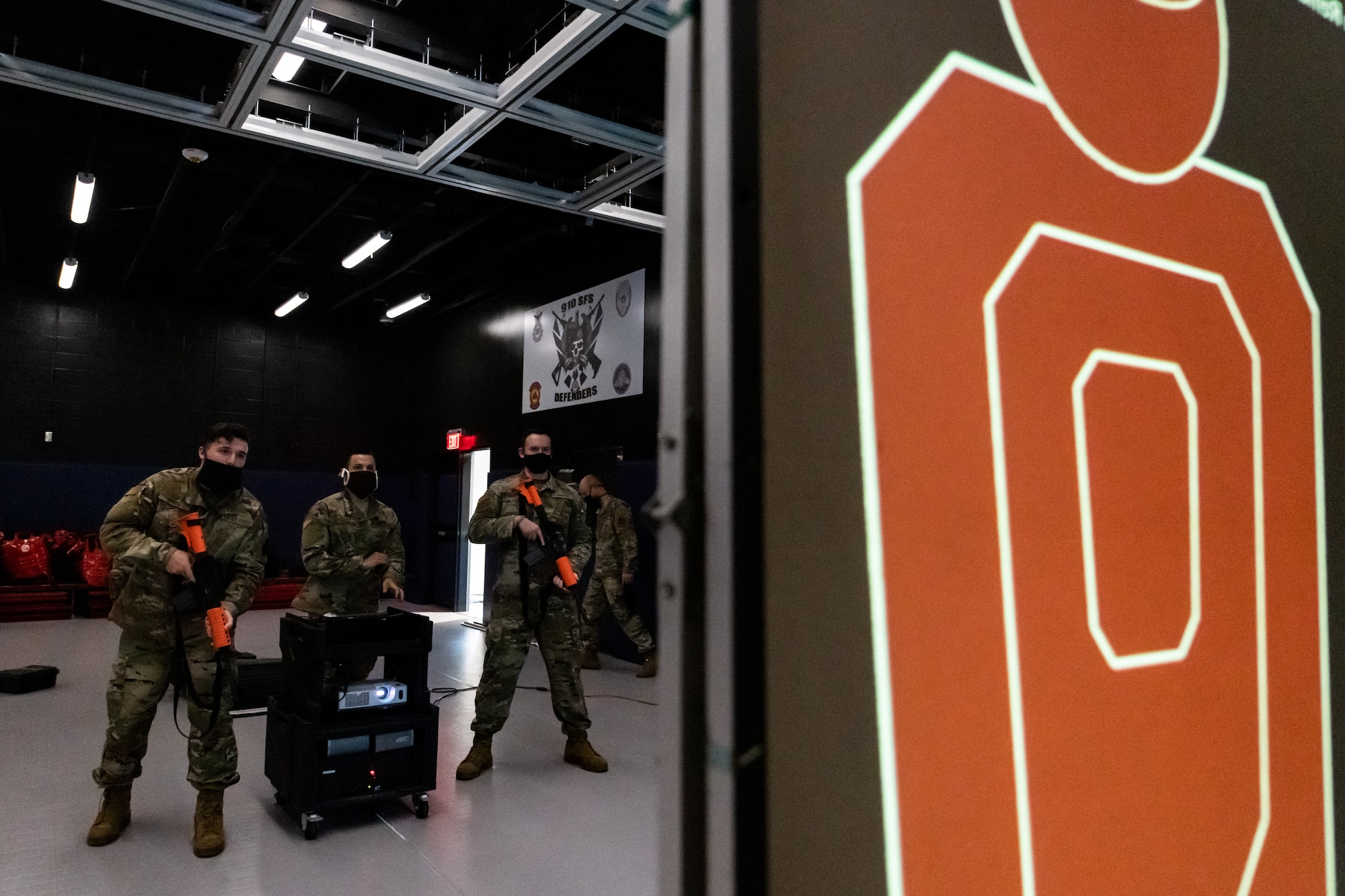 Fireteam members assigned to the 910th Security Forces Squadron practice on the squadron’s state-of-the-art laser shot simulator, Sept. 12, 2020, Youngstown Air Reserve Station. The laser shot can simulate a wide variety of situations from simple target practice to time-critical situations.