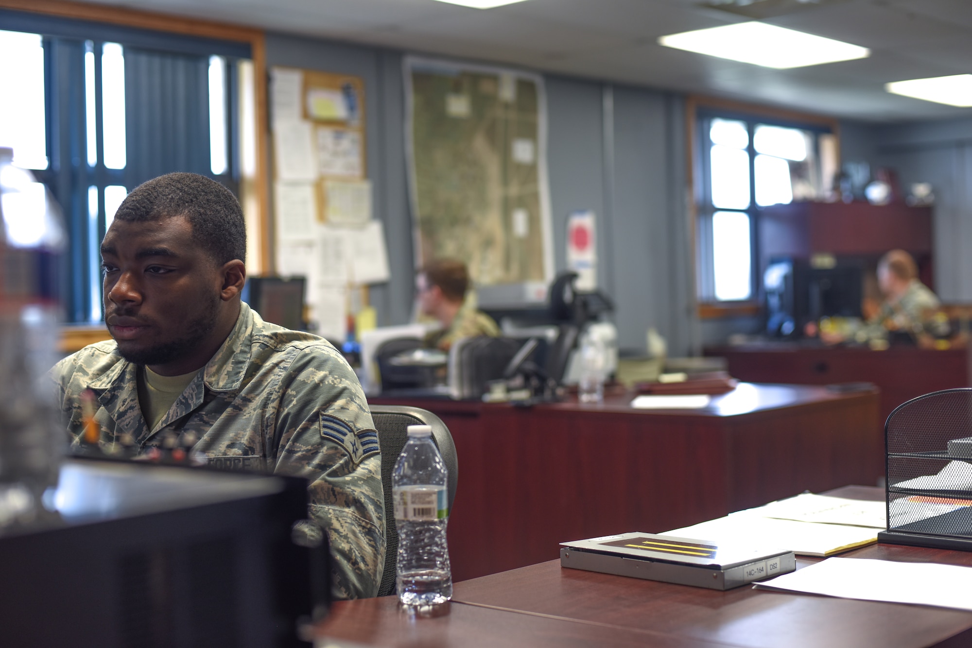 Man at desk looking at computer