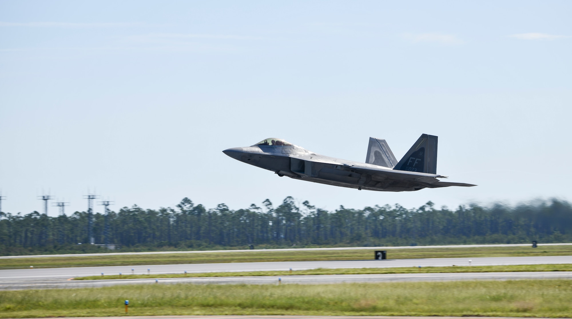 A U.S. Air Force F-22 Raptor assigned to Nellis air Force Base, Nevada, takes flight at Tyndall Air Force Base, Florida, Sept. 18, 2020. Langley, along with other units assigned to Air Combat Command, participated in a Weapons System Evaluation Program, which is an event held where air-to-air and air-to-ground armament systems proficiency is tested to maintain mission integrity. (U.S. Air Force photo by Senior Airman Stefan Alvarez)