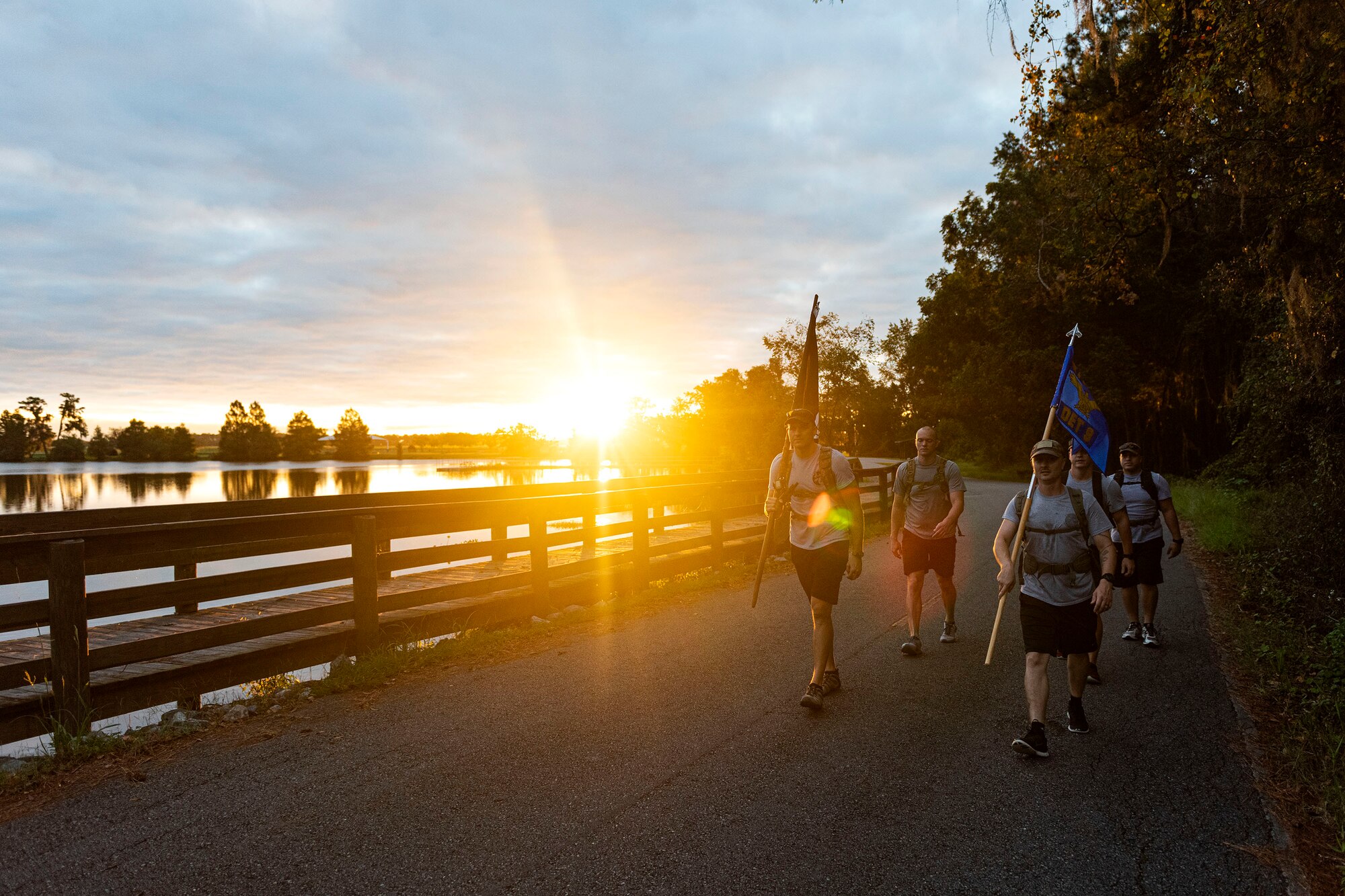 Photo of Airmen participating in a ruck march.
