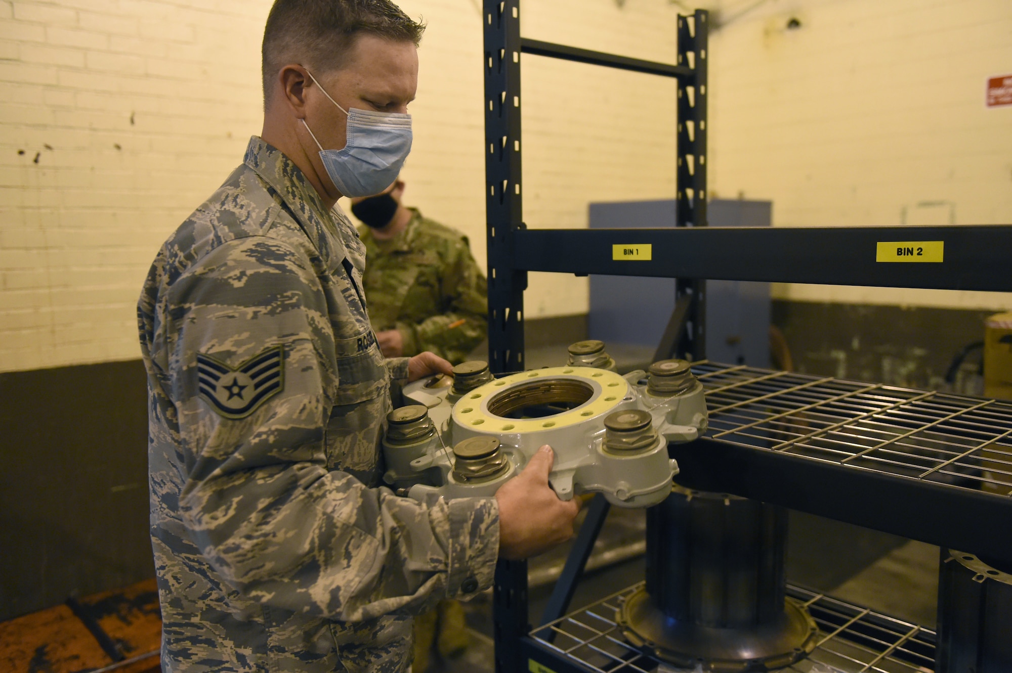 Staff Sgt. Stephan Rozsel, 62nd Maintenance Squadron aircraft hydraulic systems specialist, takes a C-17 Globemaster III hydraulic brake housing off a shelf on Joint Base Lewis-McChord, Wash., Sept. 10, 2020. The hydraulics shop balances equipment maintenance and repair requests from multiple 62nd MXG agencies in addition to taskings from other units and organizations. (U.S. Air Force photo by Airman 1st Class Mikayla Heineck)