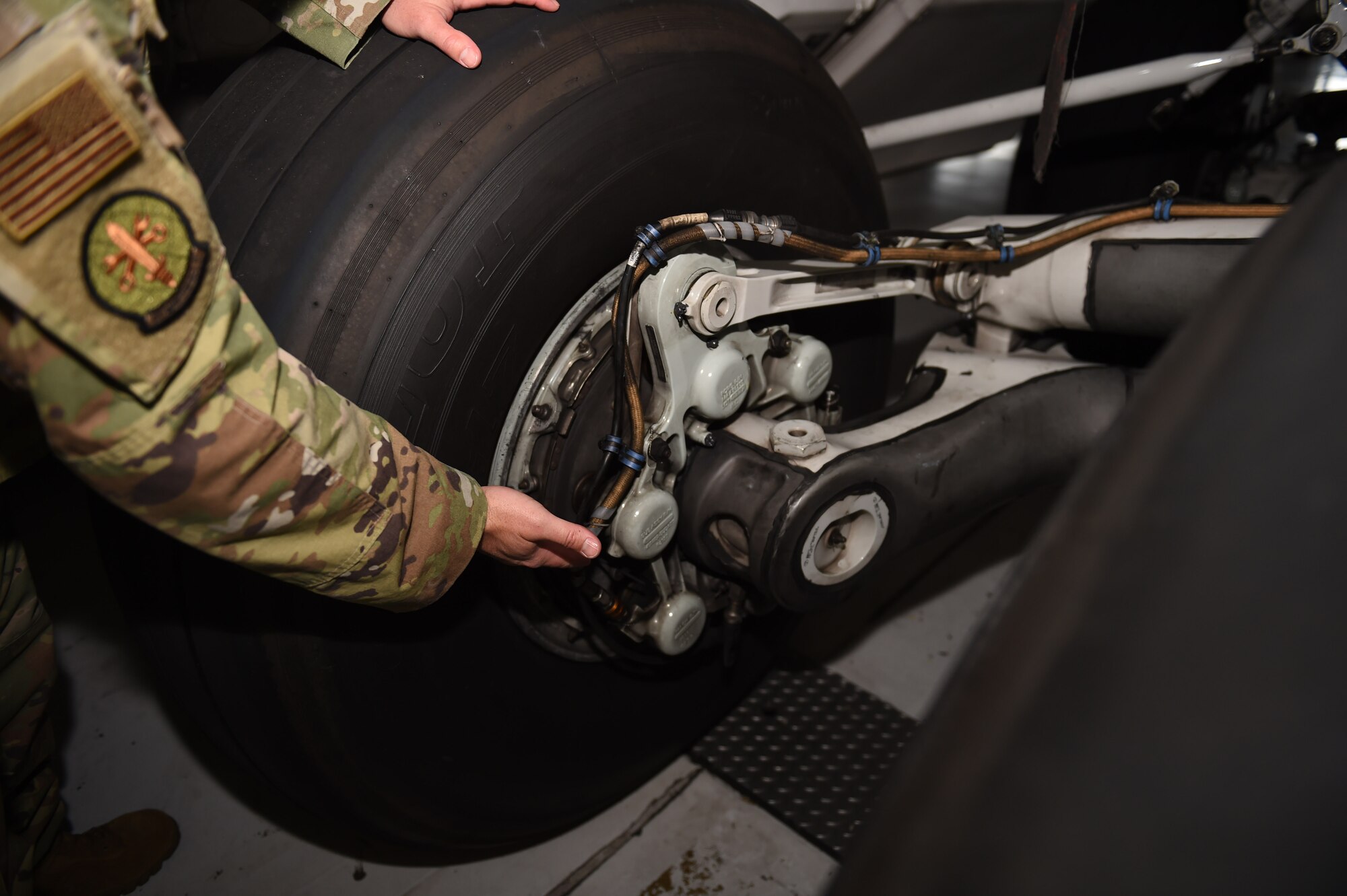 Master Sgt. Warren Hessler, 62nd MXS hydraulics section chief, points out the hydraulic hose on a C-17 Globemaster III brake system on Joint Base Lewis-McChord, Wash., Sept. 10, 2020. The hydraulics shop balances equipment maintenance and repair requests from multiple 62nd Maintenance Group agencies as well as other units and organizations. (U.S. Air Force photo by Airman 1st Class Mikayla Heineck)